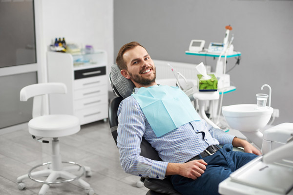 A man in dental chair ready for oral surgery